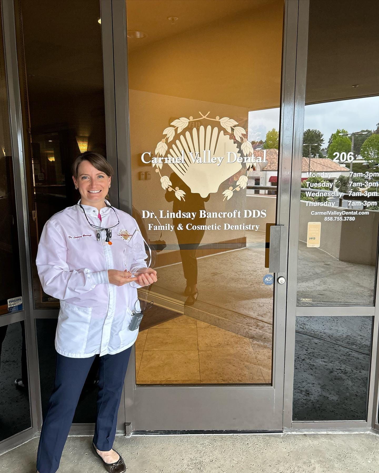 Dr. Lindsay Bancroft DDS posing at the front door of Carmel Valley Dental - Carmel Valley Dental Dr. Lindsay Bancroft DDS posing at the front door of Carmel Valley Dental - Carmel Valley Dental