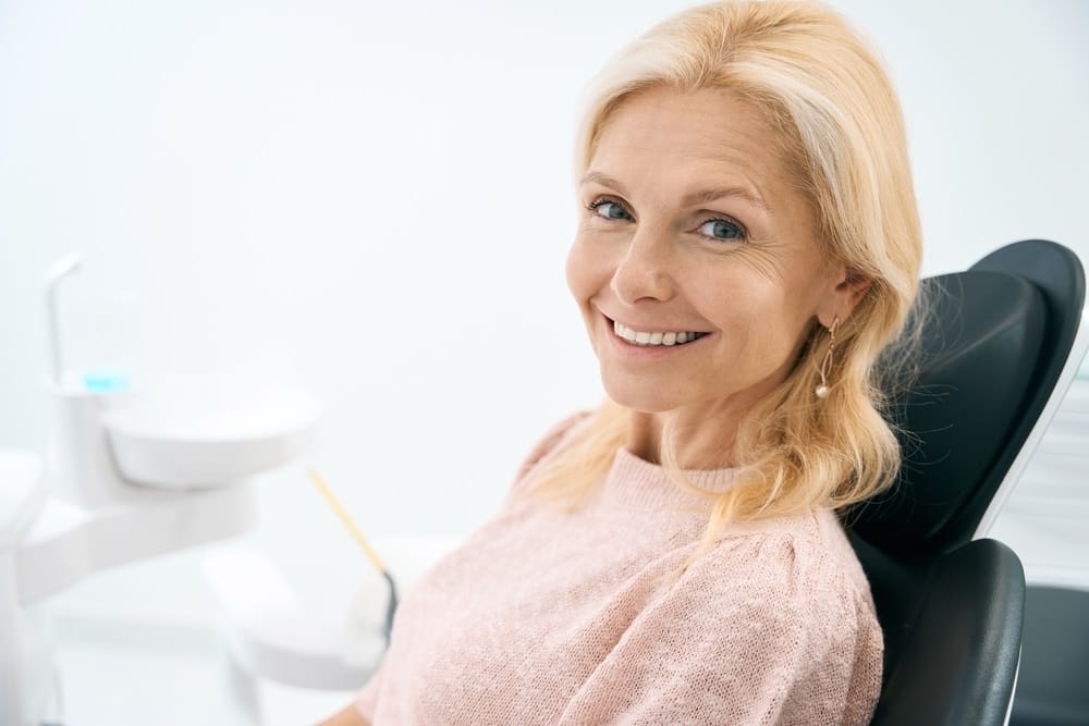 woman sitting in dental chair at medical - Dental Exams woman sitting in dental chair at medical - Dental Exams