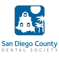 Logo of the San Diego County Dental Society featuring a white building, palm trees, and a sun within a blue square - Carmel Valley Dental Logo of the San Diego County Dental Society featuring a white building, palm trees, and a sun within a blue square - Carmel Valley Dental
