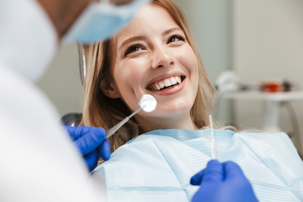 woman sitting in dental chair at medical - Dental Exams woman sitting in dental chair at medical - Dental Exams